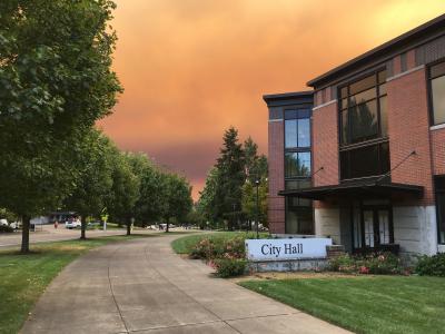 City Hall with orange skies from nearby wildfires