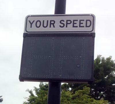 Speed sign on poll