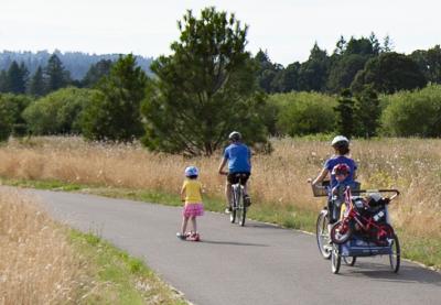 Family biking on Graham Oaks trail