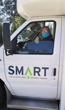 SMART bus driver shown with mask on