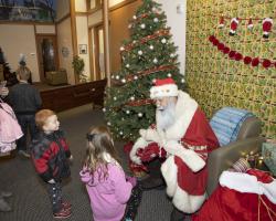 kids greeting santa