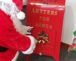 Santa checking mailbox