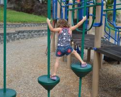child on play structure